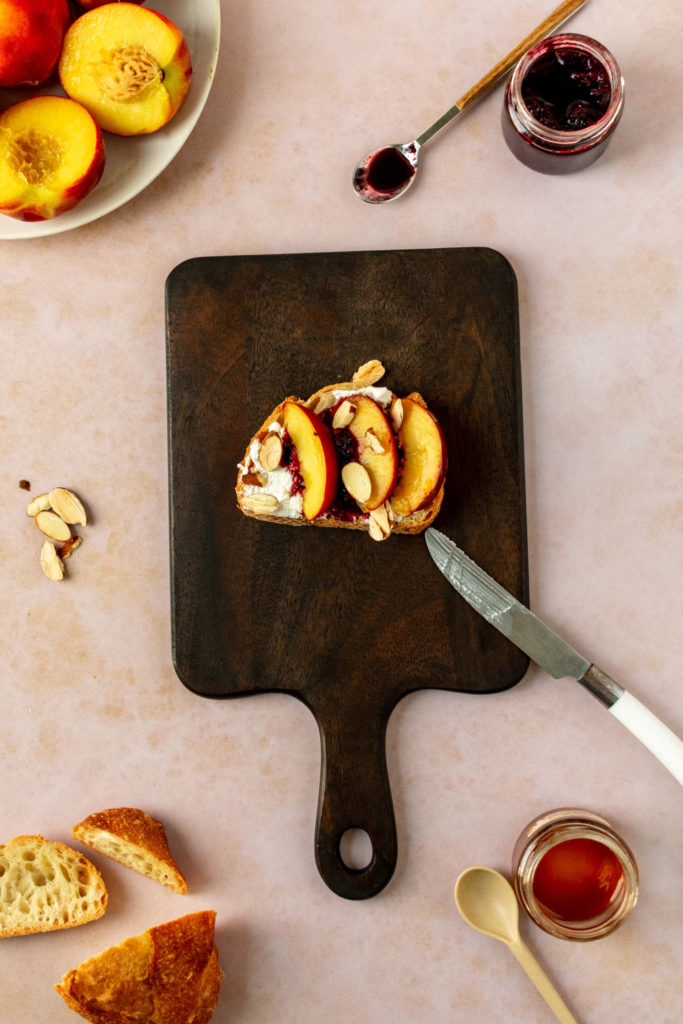 Ricotta, Peach Toast with blackberry compote topped with almonds and honey