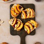 Ricotta, Peach Toast with blackberry compote topped with almonds and honey