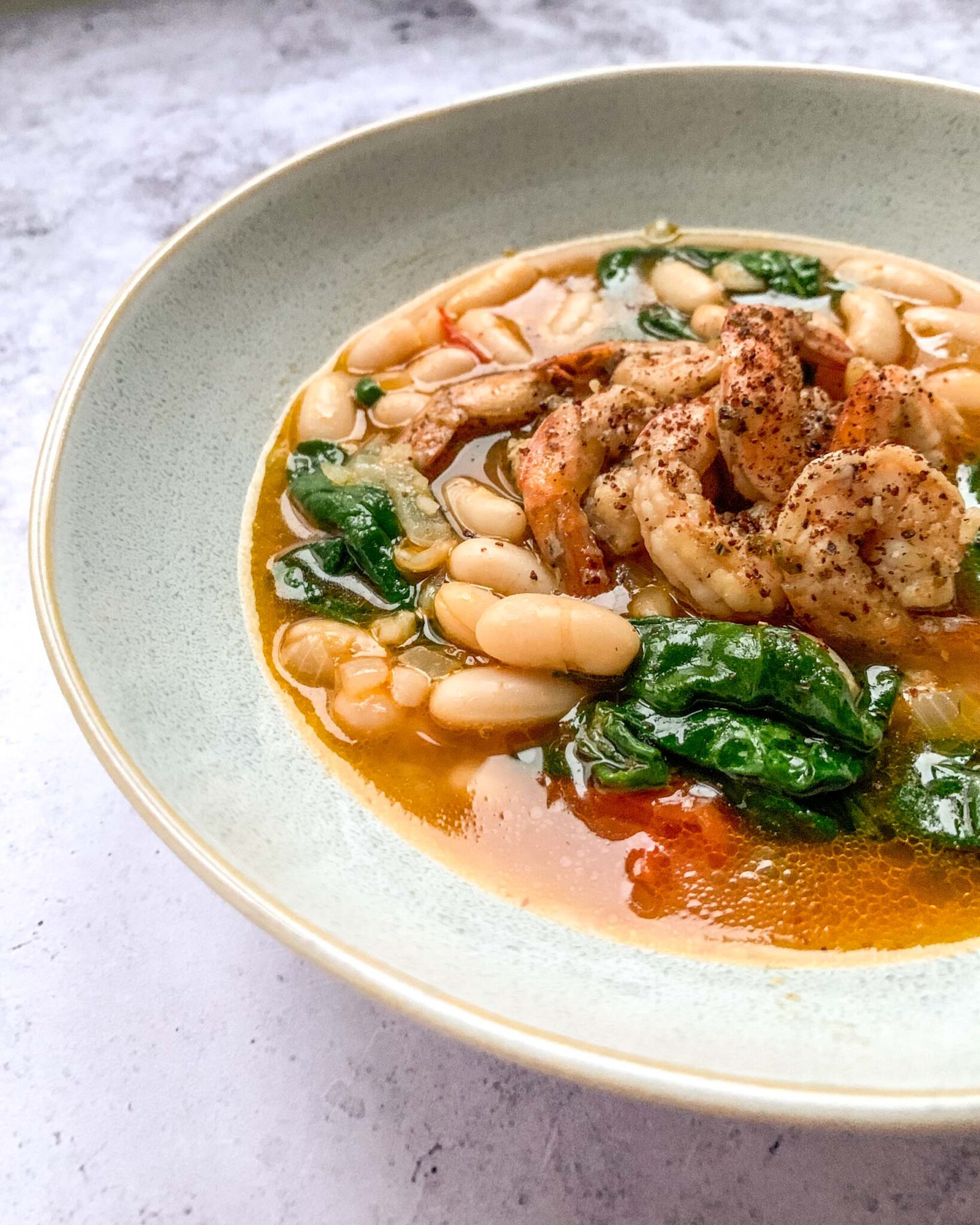 Harissa Cannellini Beans Soup with Sumac Shrimp Apron & Whisk