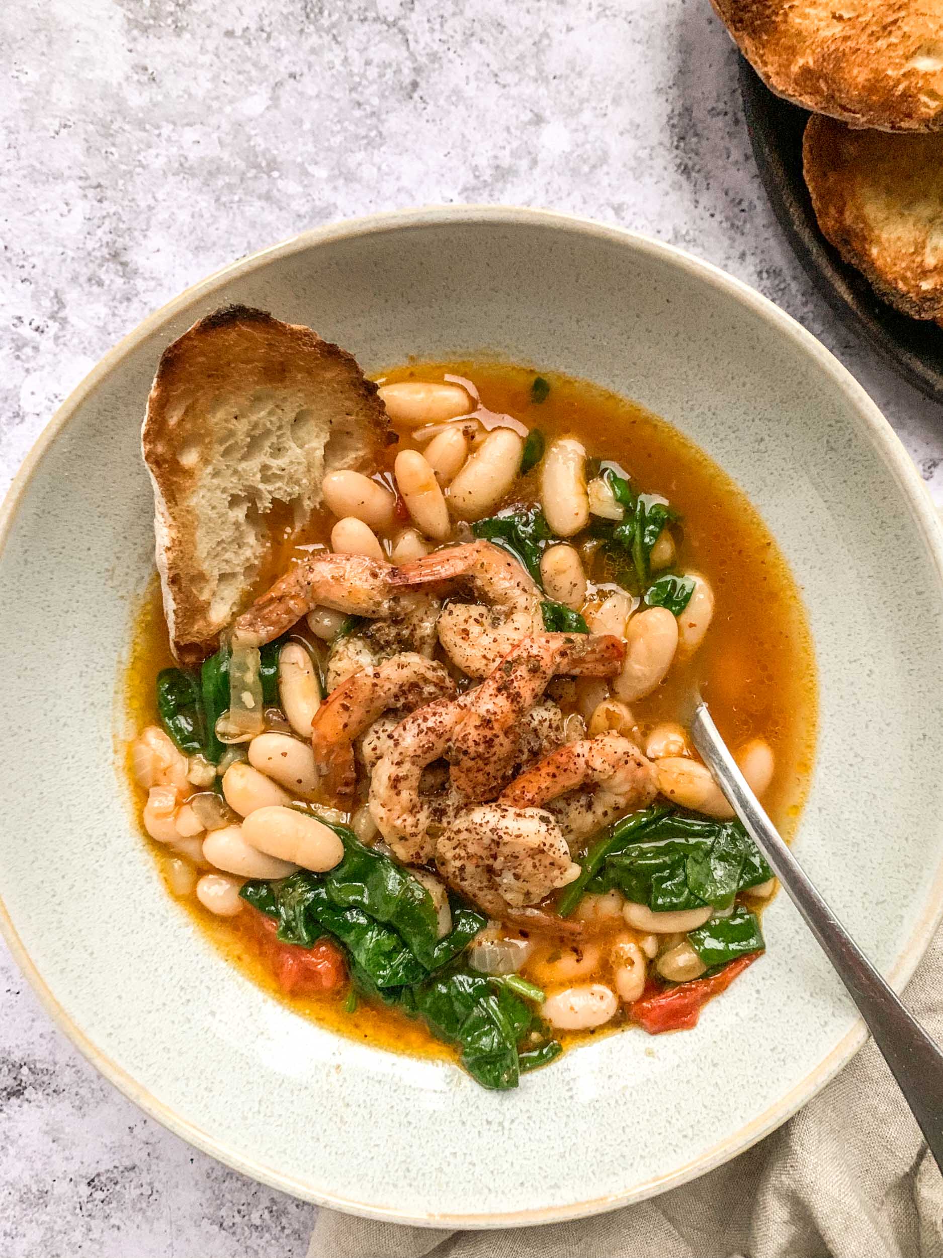 Harissa Cannellini Beans Soup with Sumac Shrimp Apron & Whisk