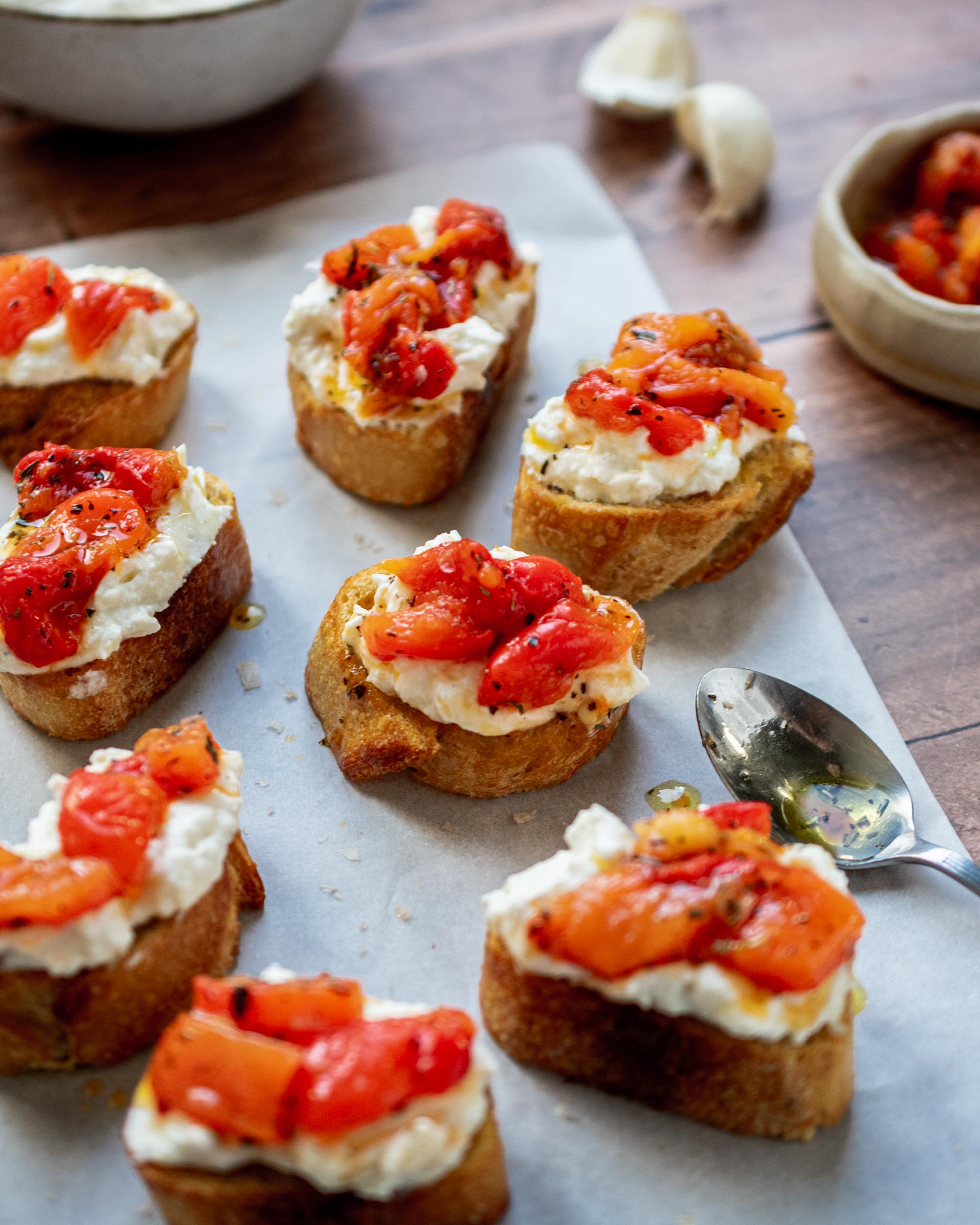 https://apronandwhisk.com/wp-content/uploads/2023/06/Roasted-Garlic-Ricotta-and-Red-Peppers-Crostini-Apron-Whisk-3.jpg