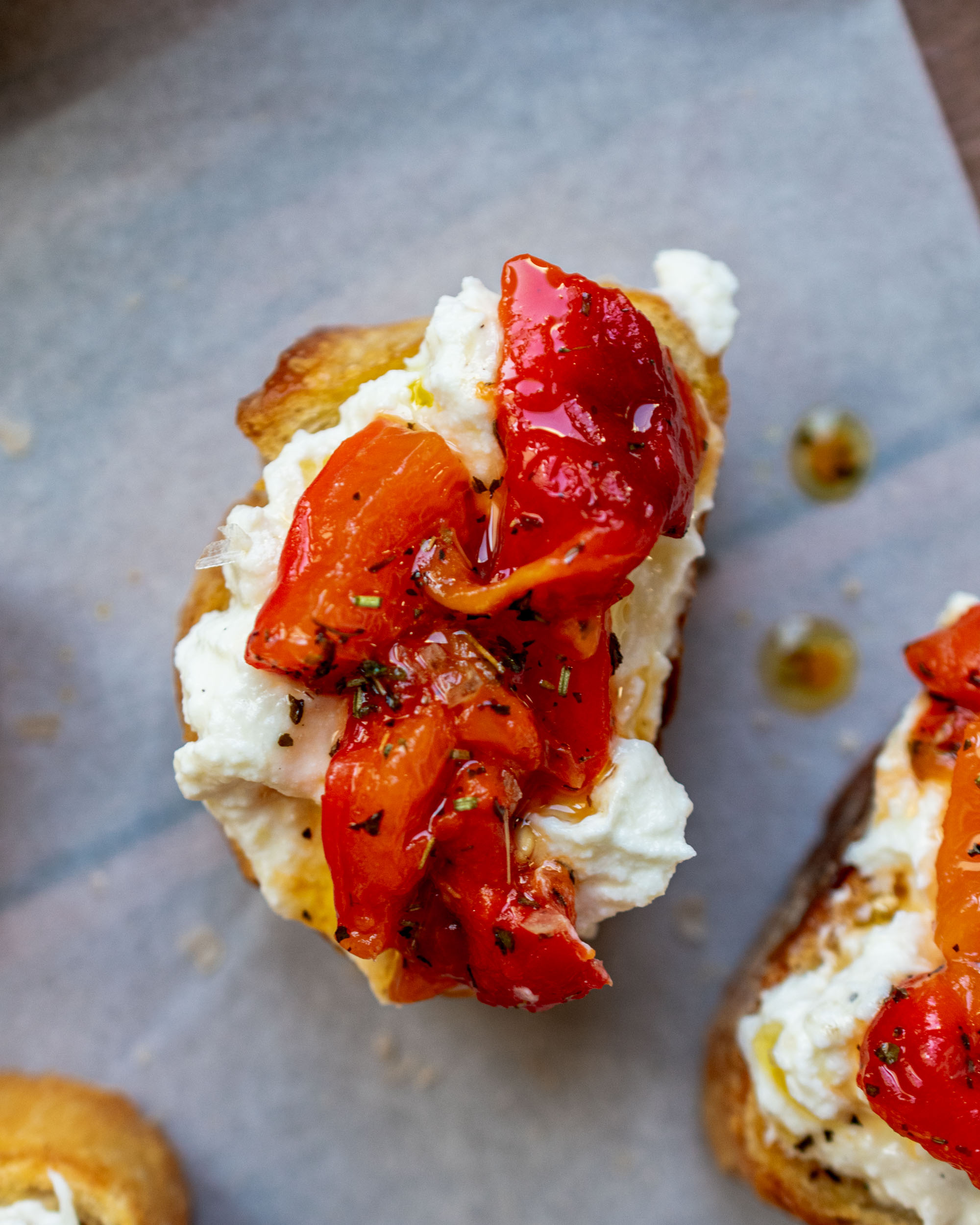 Roasted Garlic Ricotta and Red Peppers Crostini Apron & Whisk