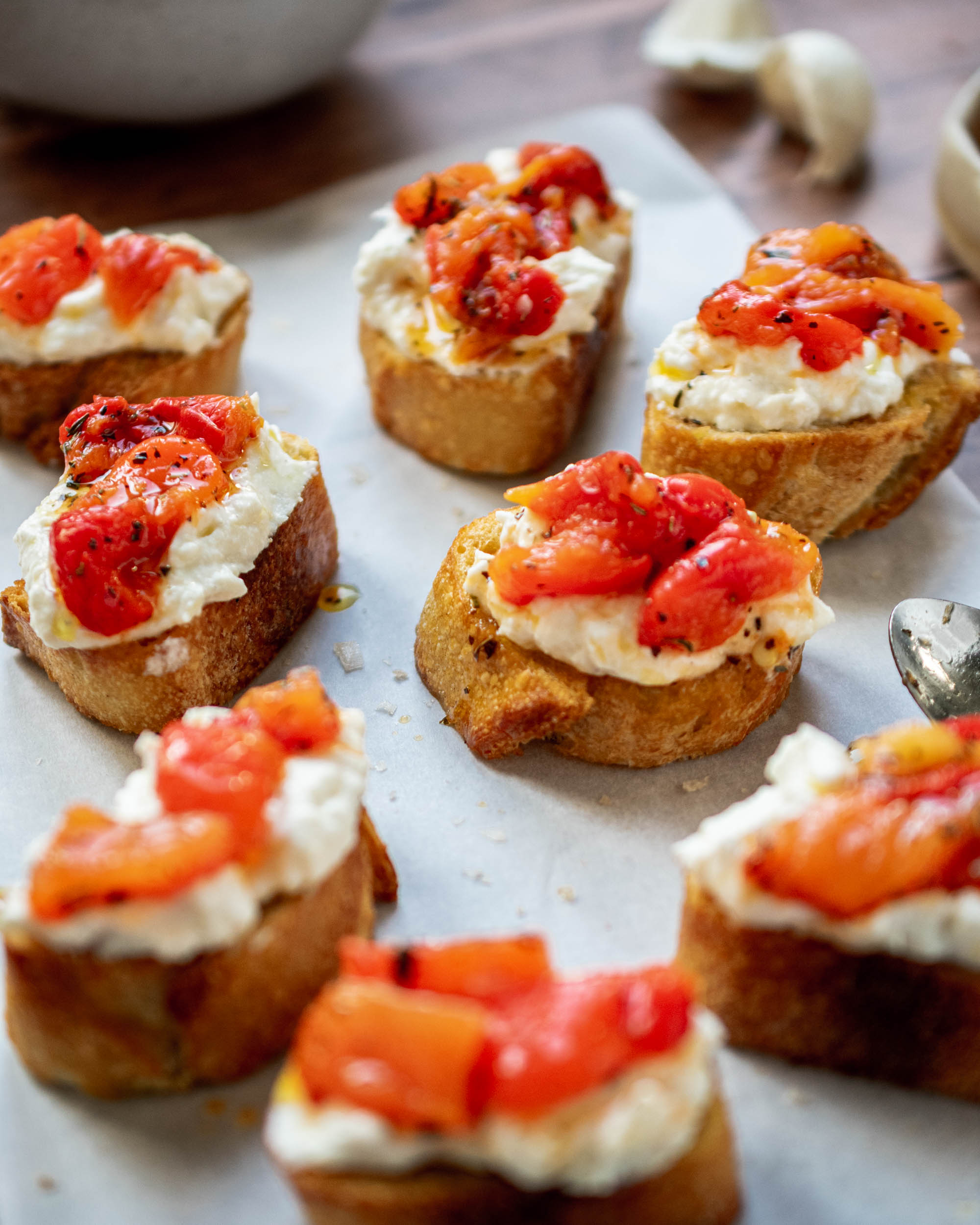 Roasted Garlic Ricotta and Red Peppers Crostini - Apron & Whisk