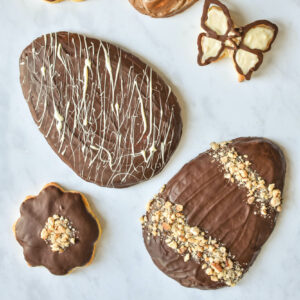 Decorated Figolli cookies, highlighting the variety of shapes and vibrant icing designs.